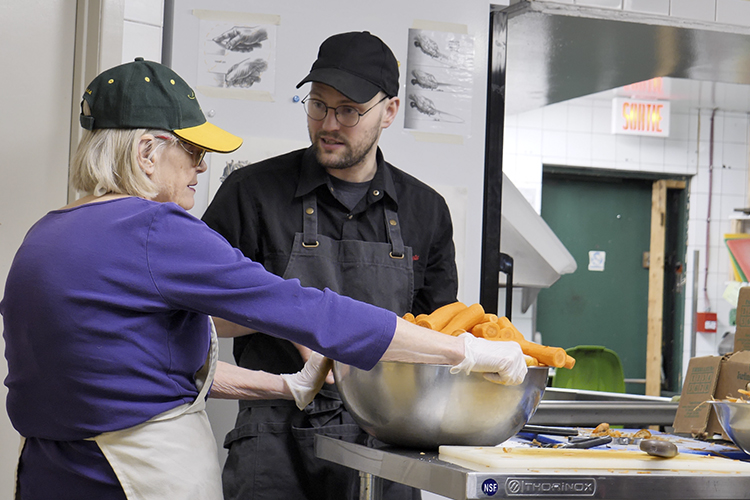 Employees prepare food at the NDG Food Depot
