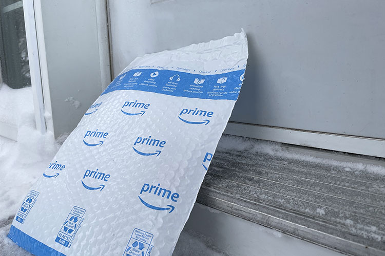 An Amazon Prime delivery on a doorstep.