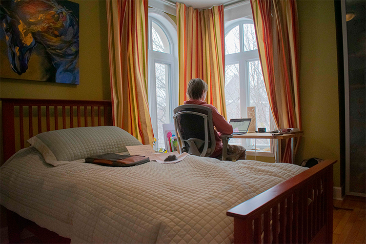 Simon Duchaine-Morneau sits in his room, at his computer.