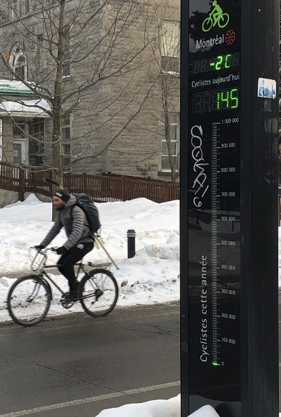 A bike counter tallies a passing cyclist in Montreal