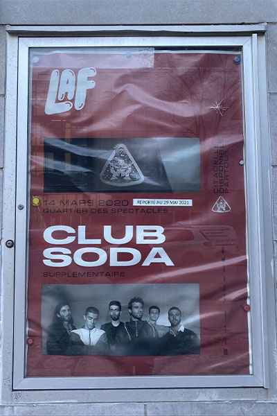 A poster outside of Club Soda music venue