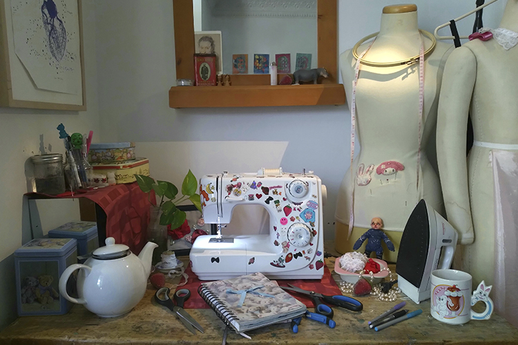 A sewing workspace of an upcycling fashion designer