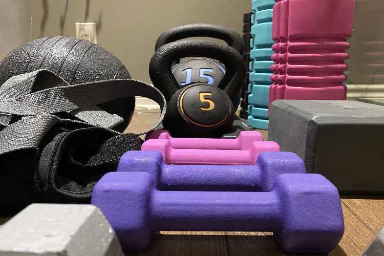 Several weights in a home gym.