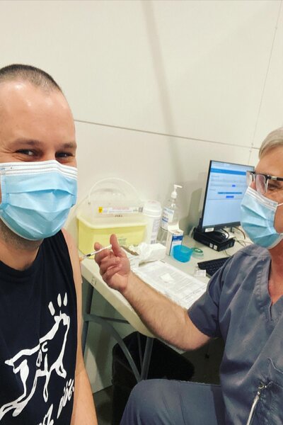 Jaris Swidovich receives his vaccine.