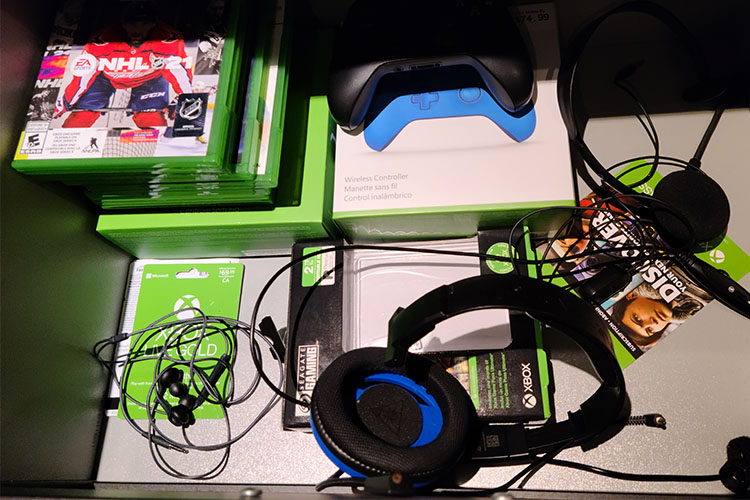 A close up of gaming items such as headphones and controllers