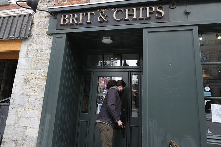 Jo entering a Brit and Chips restaurant