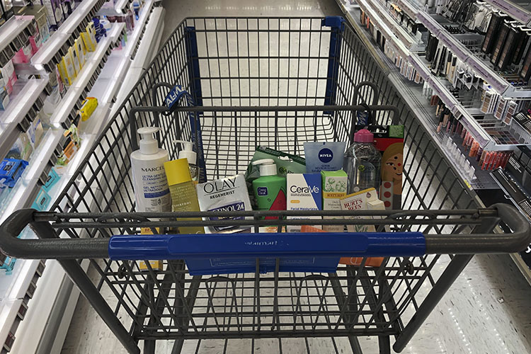 A shopping cart filled with skincare products