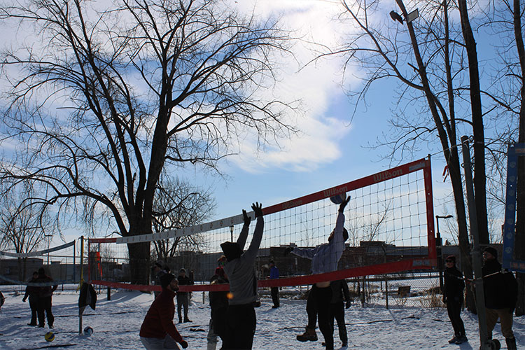 snow volleyball players playing in Montreal