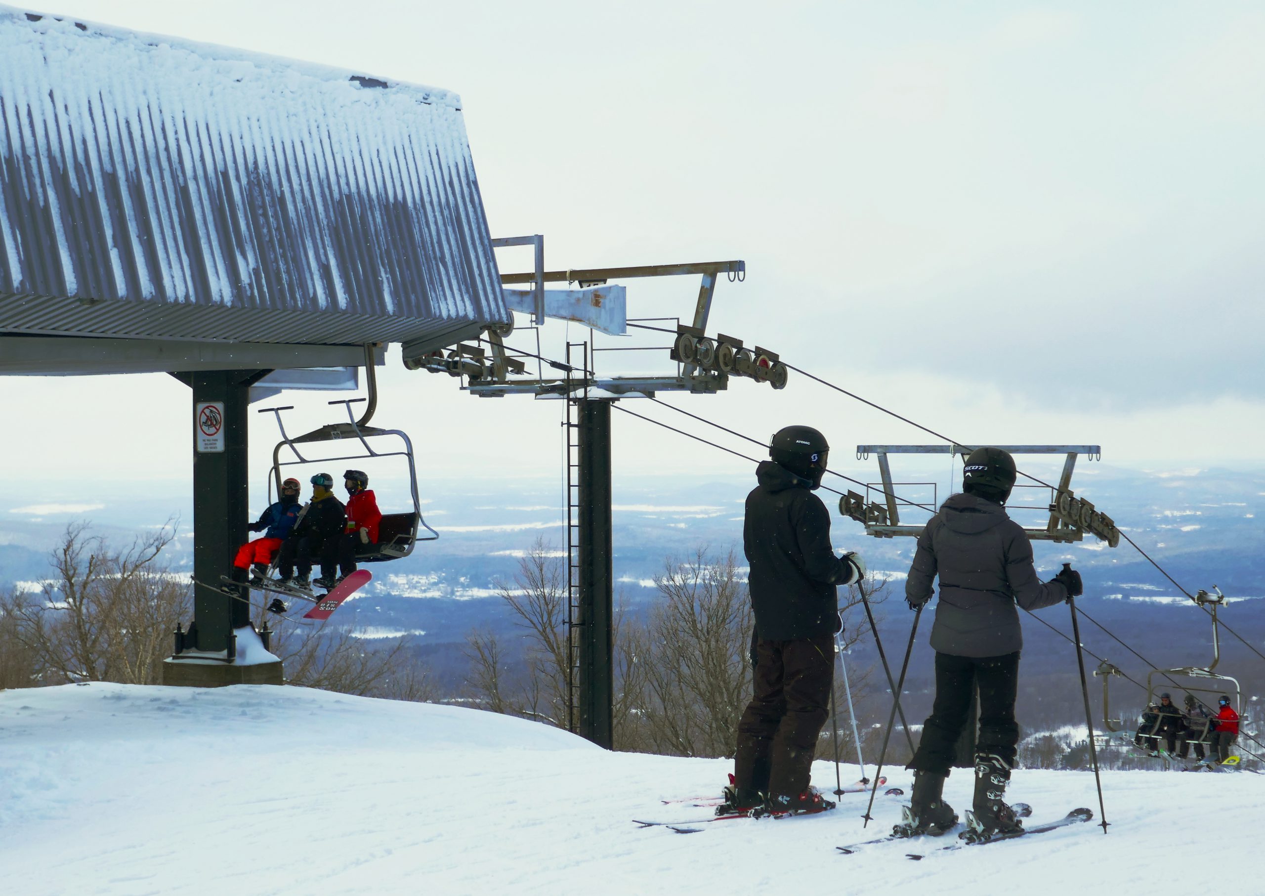 Skiers using a ski lift.