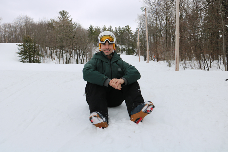 Brendan Mergl posing for a photo on the ski hill at Mont-Rigaud
