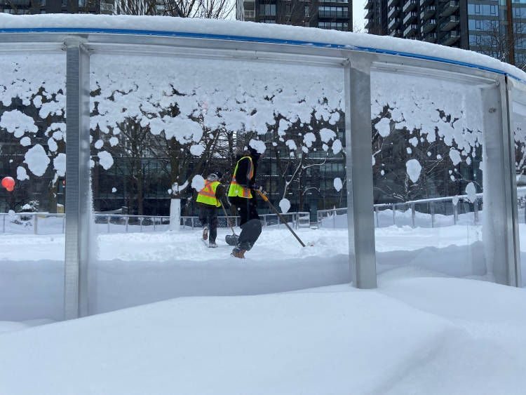 City workers working on the rink