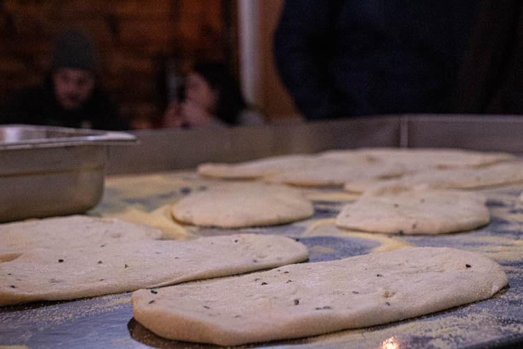 Close-up on Kahwa Cafe's famous home-made bread dough while it is being prepared and resting.