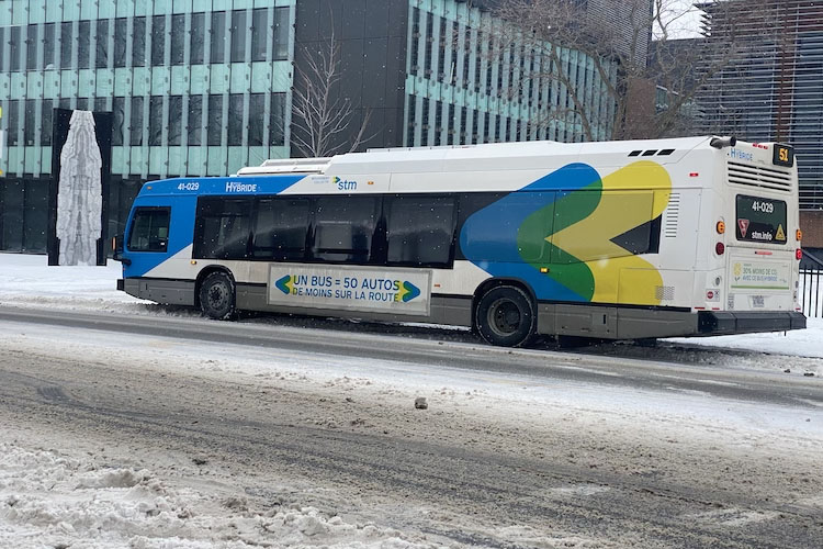 a bus passing by with the STM slogan