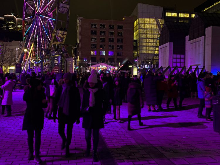 Ferris wheel and crowd at Montreal en Lumiere
