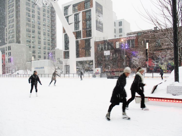 Skaters at Place-Des-Arts ice rink.