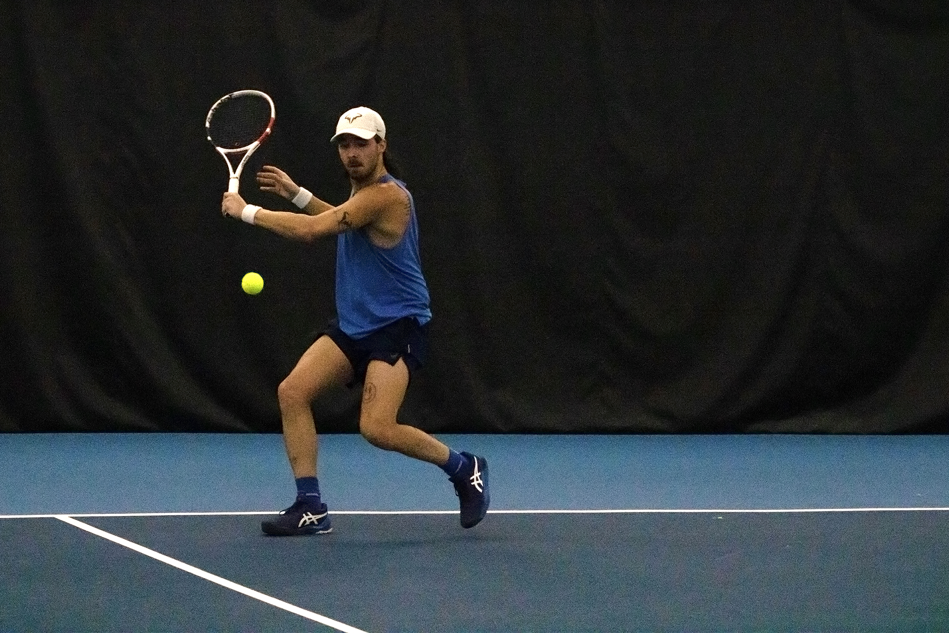 Alec Brideau hitting his patented two-handed backhand