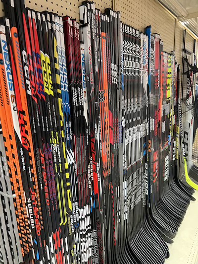 New and used hockey sticks on display