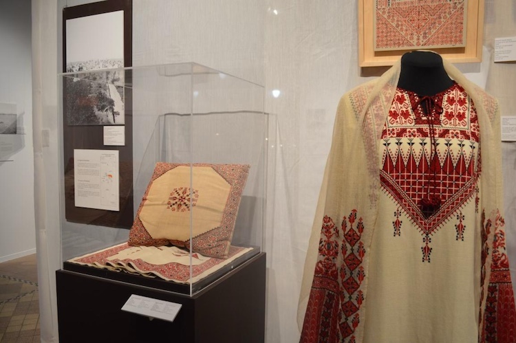 Different items presented at El-Khairy's exhibit, including a traditional Palestinian dress.